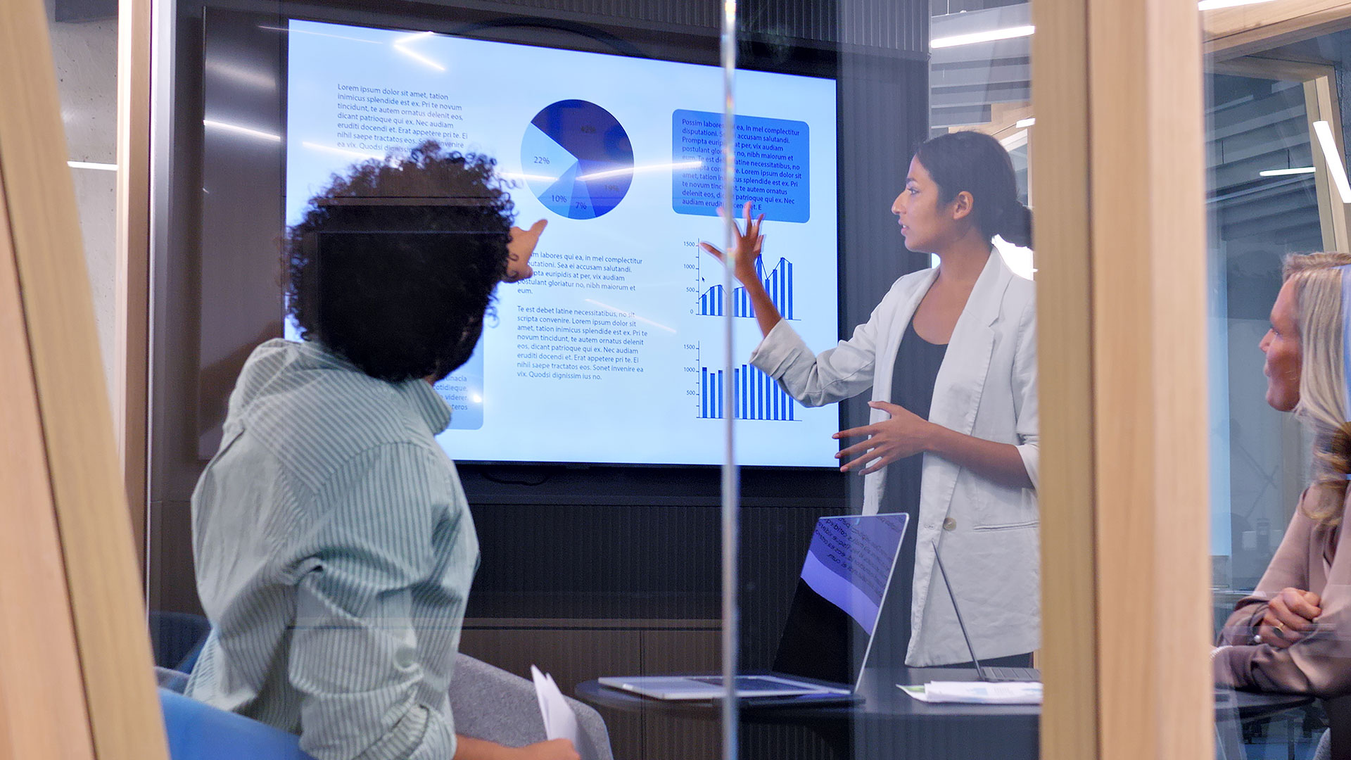 Woman explaining a data set to her co-worker.