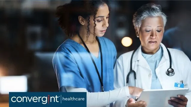 Two physicians looking at a chart