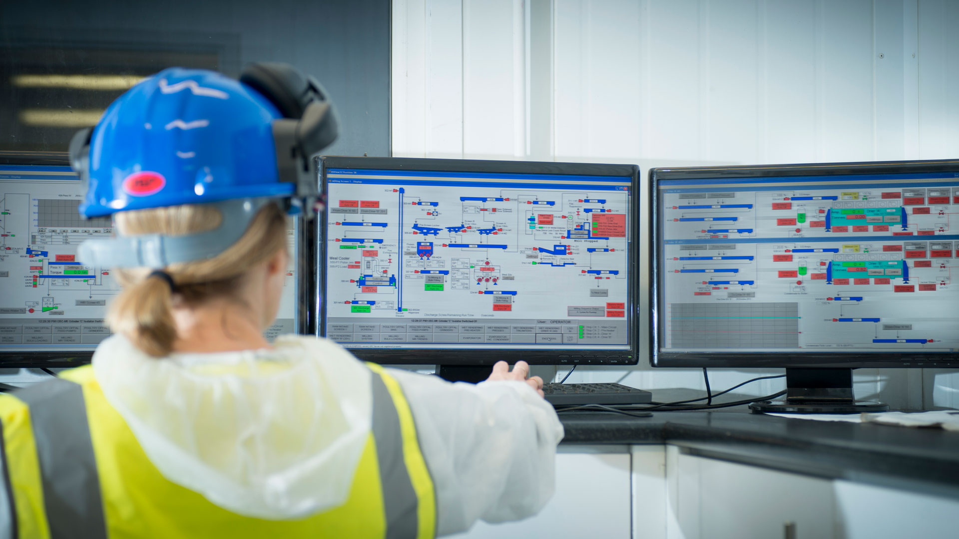 Professional at work monitoring system controls.