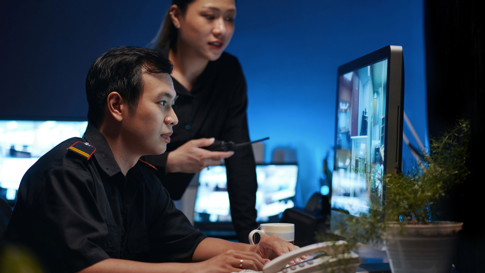 Security Workers Cooperating In Room