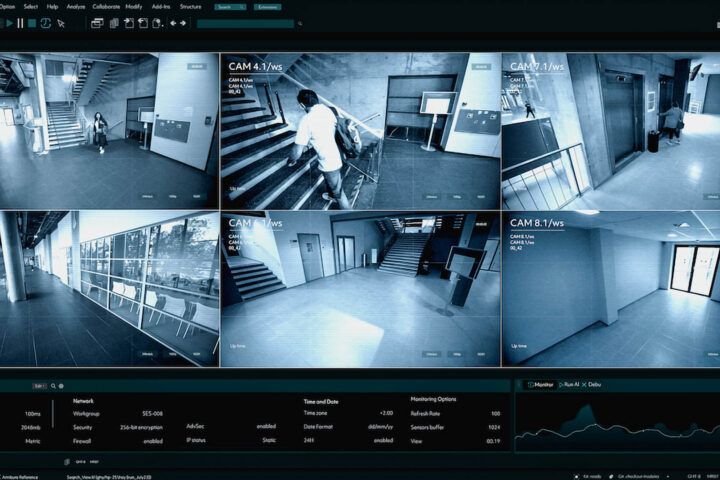 multiple security camera views with a user interface and graphs displayed around it