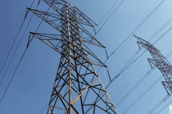 an exterior shot of power line towers