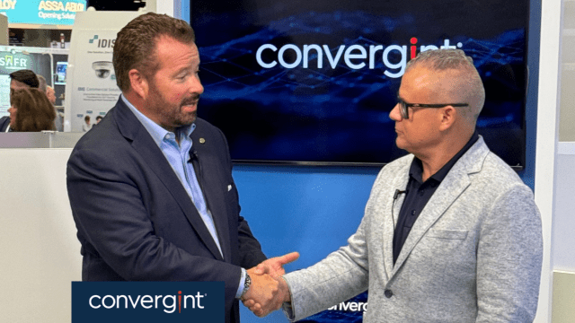 Two Convergint workers shaking hands