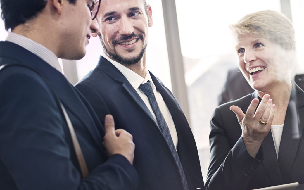 Group of business people having a successful, fun conversation