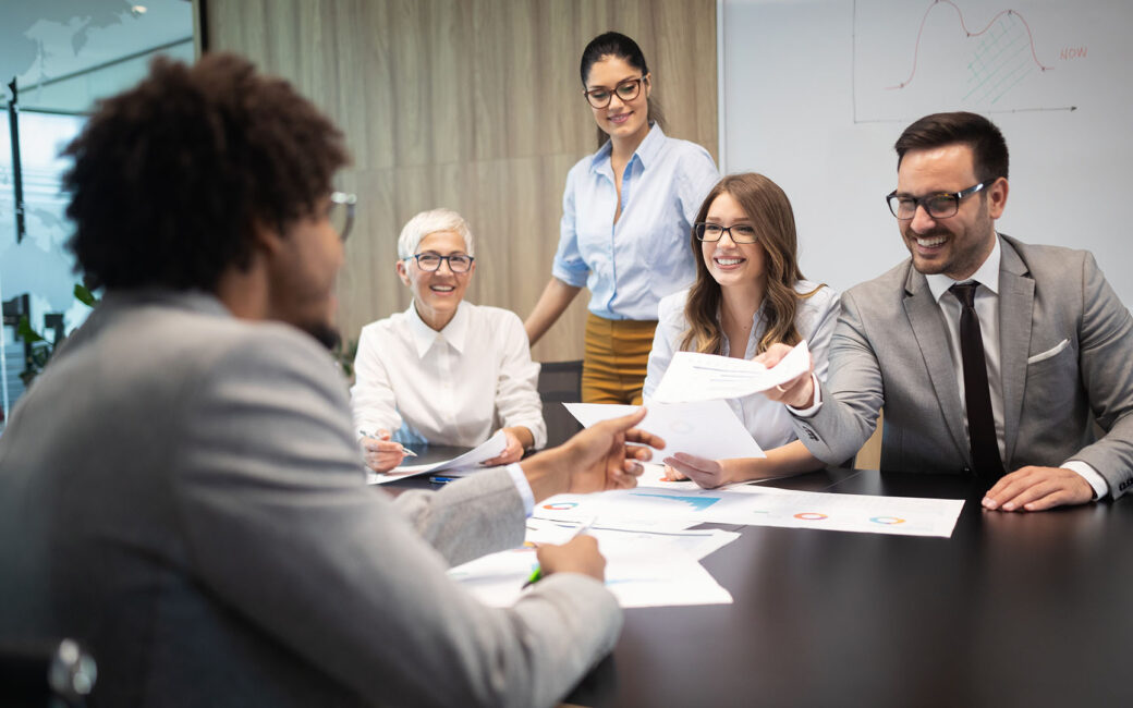Successful group of business people at work in an office having a meeting